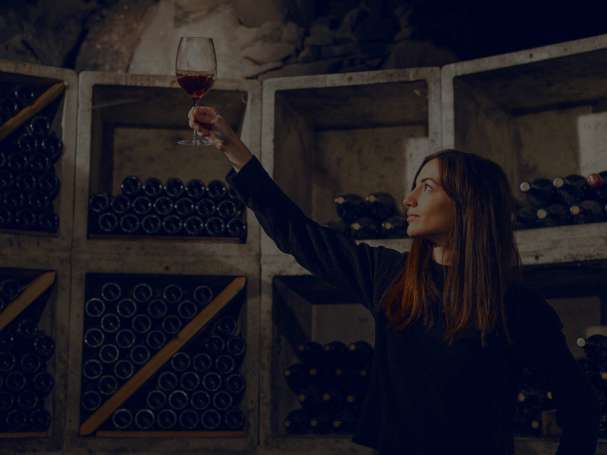 Woman holding glass of wine