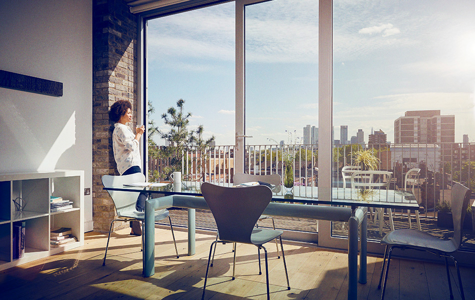 Woman looking out window in home